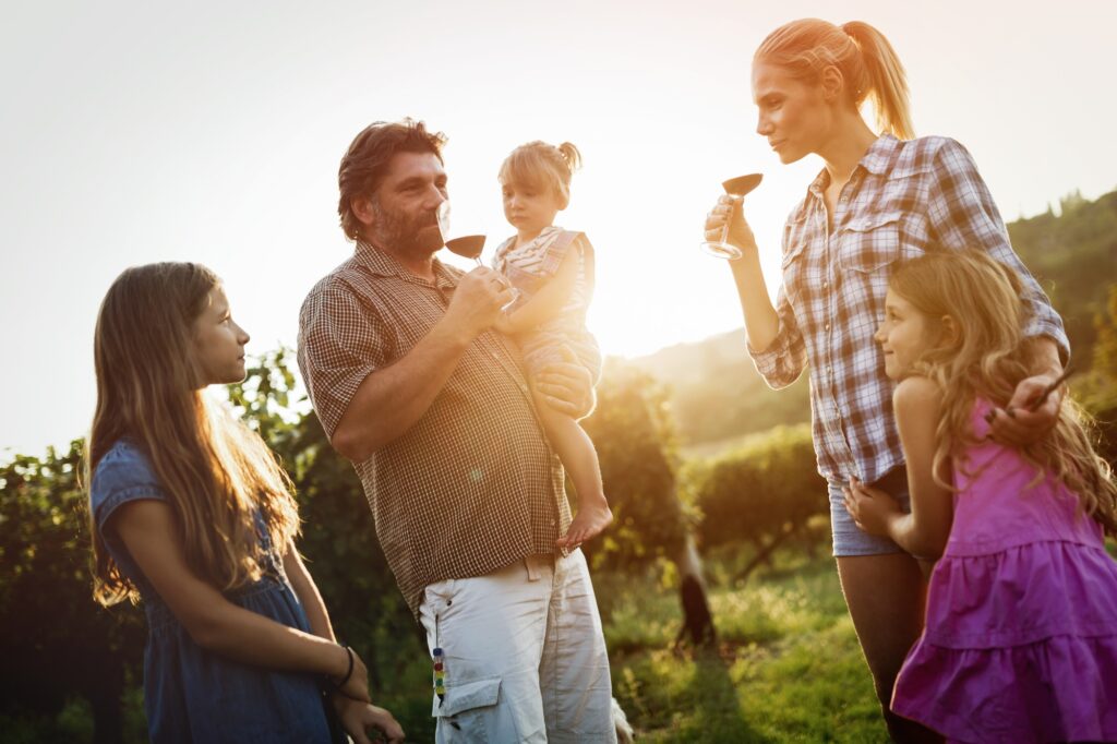 Winemaker family together in vineyard
